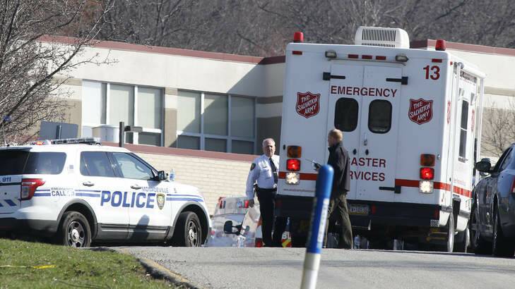 Emergency responders gather in the parking lot of the Franklin Regional High School where 19 students and one adult were stabbed on Wednesday. The suspect, a male student, was taken into custody and being questioned. Photo: AP Photo
