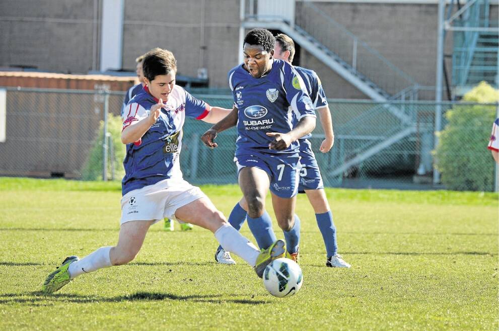 Olympia's Nick Lanau-Atkinson and Northern Rangers' Warren Wadawu in action. Picture: PAUL SCAMBLER.