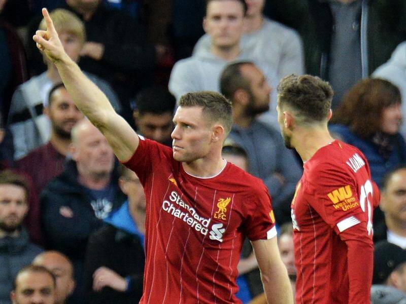 James Milner (L) has scored a last-gasp penalty to keep Liverpool at the EPL's summit.