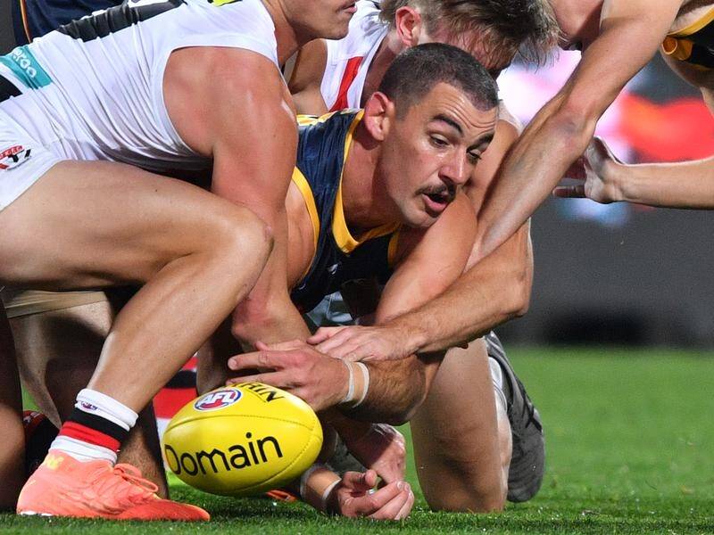 Taylor Walker says new AFL rules regarding holding the ball has changed the way players compete.