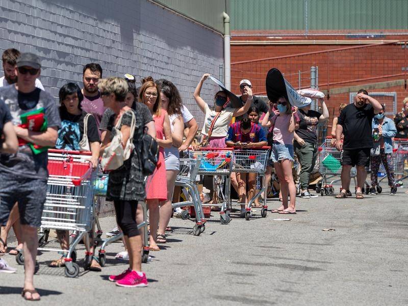 Long queues formed outside Coles in Maylands on Sunday.