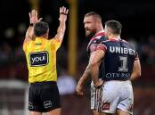 Jared Waerea-Hargreaves of the Roosters (c) is sent to the sin bin by referee Gerard Sutton.