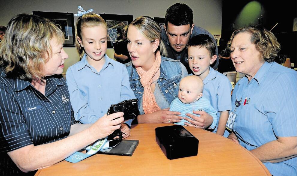 Maternity nurse unit manager Jenny Pople and the Clayton family, Erin, 8, Karen, baby Jake, 4 months, Ben and Cody, 6, with maternity nurse unit manager Wendy Newman and the new camera kit. Picture: GEOFF ROBSON