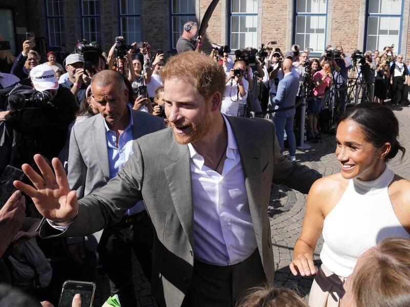 Prince Harry and Meghan have met people in Dusseldorf after a visit to the town hall. (AP PHOTO)