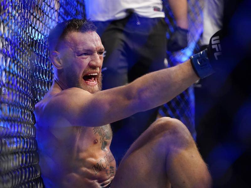 Conor McGregor yells out after breaking his shin in his UFC loss to Dustin Poirier.