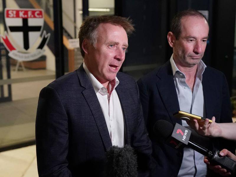 St Kilda CEO Matt Finnis (l) says the AFL club has wiped off $4.3 million of its debt.