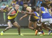 Richmond star Dustin Martin is expected to be out for two AFL games because of a hamstring injury.