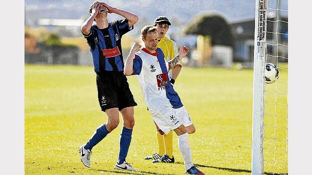 Rangers player Adam Edwards celebrates after Kingborough's Nicholas Cuthbertson knocked in an own goal.
