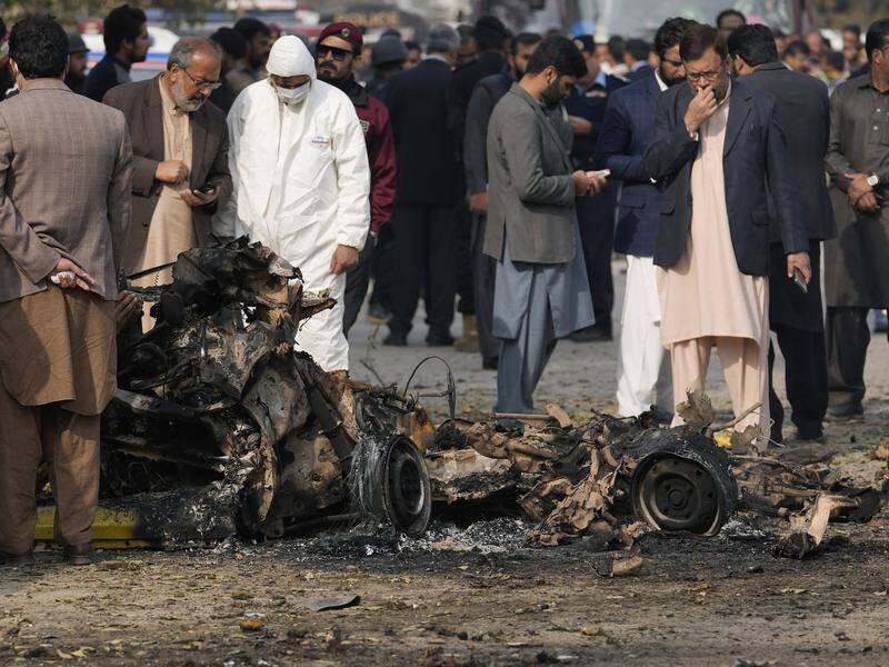 A powerful car explosion killed two suicide bombers, a passenger and a police officer in Pakistan. (AP PHOTO)