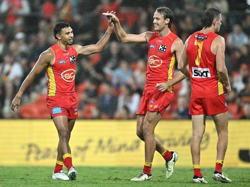 Gold Coast have survived a late Crows charge to make it back-to-back wins to start the season. (Dave Hunt/AAP PHOTOS)