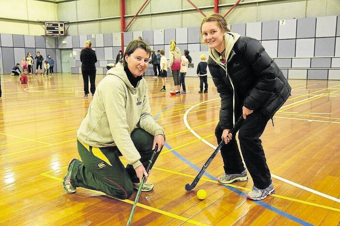 Prospect student Hailee Harris and Hockey Tasmania's Helen Partridge at the Active Deaf Kids Clinic at the Deloraine Community Complex. Picture: PAUL SCAMBLER