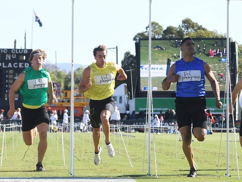 Dhruv Rodrigues-Chico (blue) wins the 2019 Stawell Gift.