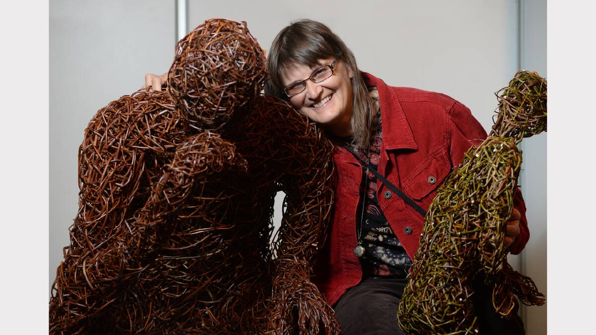Artist Rose Hamilton with "the thinker", made from dried willow, at yesterday's Launceston Easter Community Festival at the Albert Hall and City Park. Picture: MARK JESSER