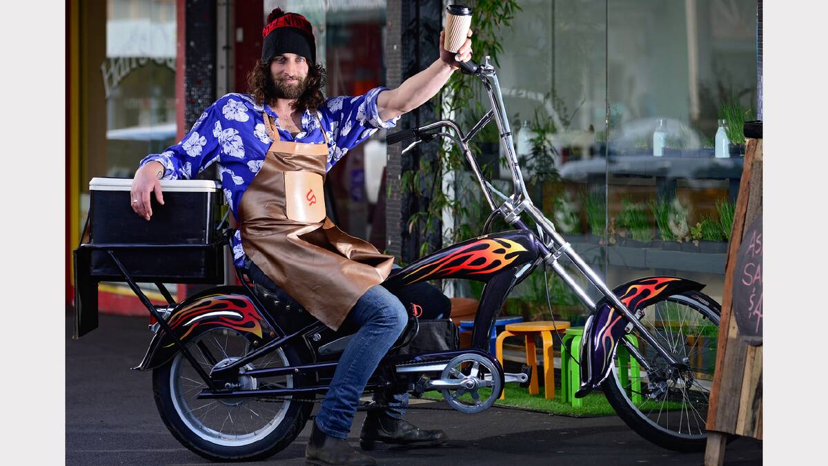 Barista Samuel Lynch of Up York, in York Street, Launceston, uses an electric bike to deliver coffee in the CBD. Picture: PHILLIP BIGGS