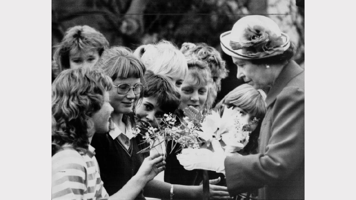 Queen Elizabeth and Prince Philip's 1988 royal visit | The cordon was not enough to stop some Brooks High School students determined to present the Queen with wattle springs from nearby trees at the TSIT.