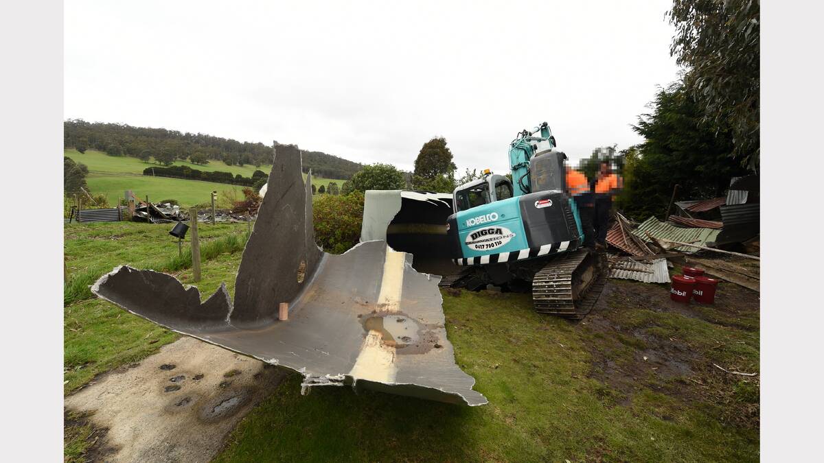 Vandals on an excavator destroyed what was left of a Frankford home that had been damaged by fire. Picture: Mark Jesser