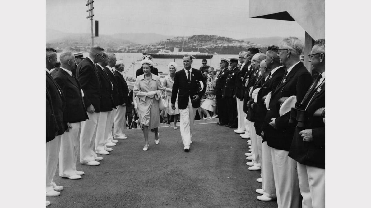 Queen Elizabeth and Prince Philip's 1963 royal visit | Regatta Association chairman Mr G. F Sorell escorts the Queen through a guard of honour.