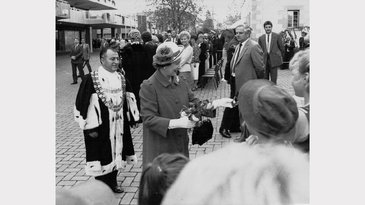 Queen Elizabeth and Prince Philip's 1988 royal visit | Launceston Mayor Jimmy Tsinoglou escorts the Queen through Civic Square during her Launceston visit.