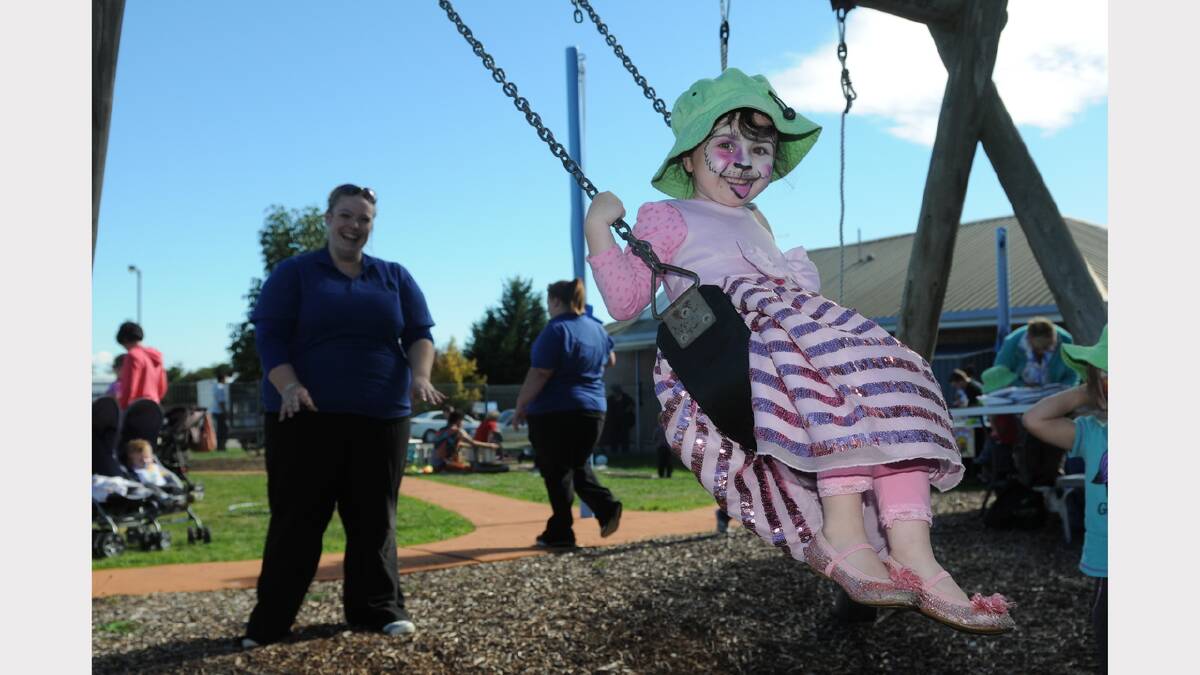 Li-Lea Pad Early Childhood Centre's Caitlin Heyward swings four-year-old Elly Hume for Magic Monday Fun Day. Picture: Paul Scambler