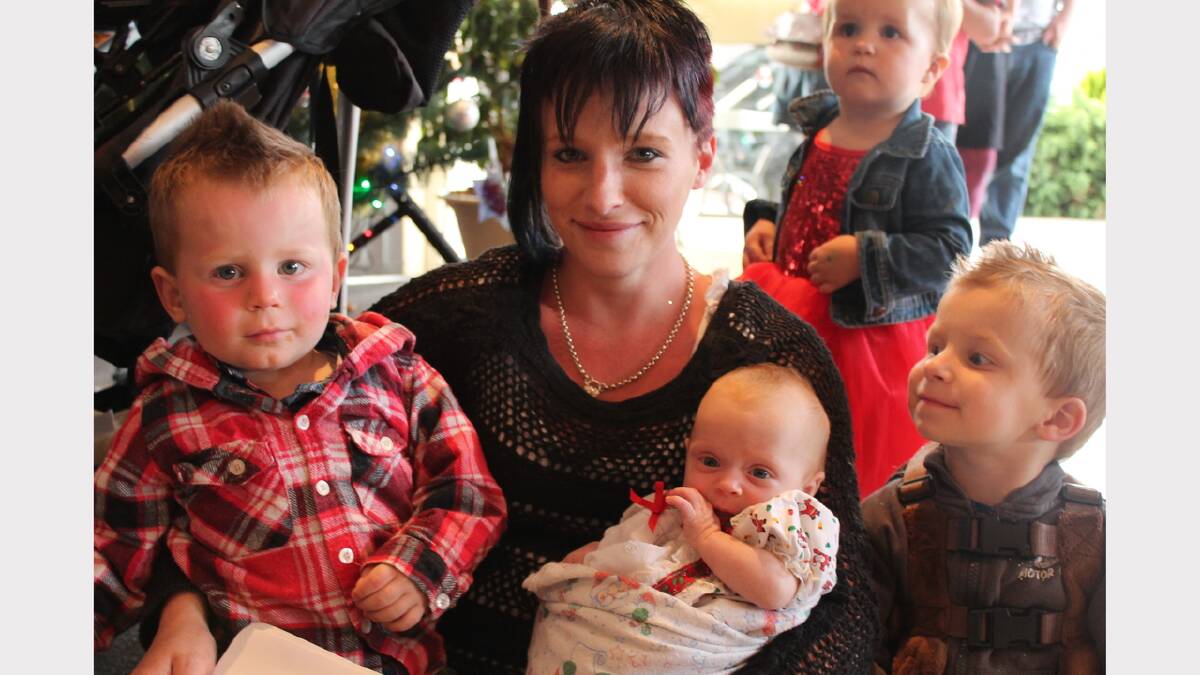 Longford's Lena Reid with children Mason, 2, Lexie, three months, and Luke, 3, at the Riverlands Christmas carols event.