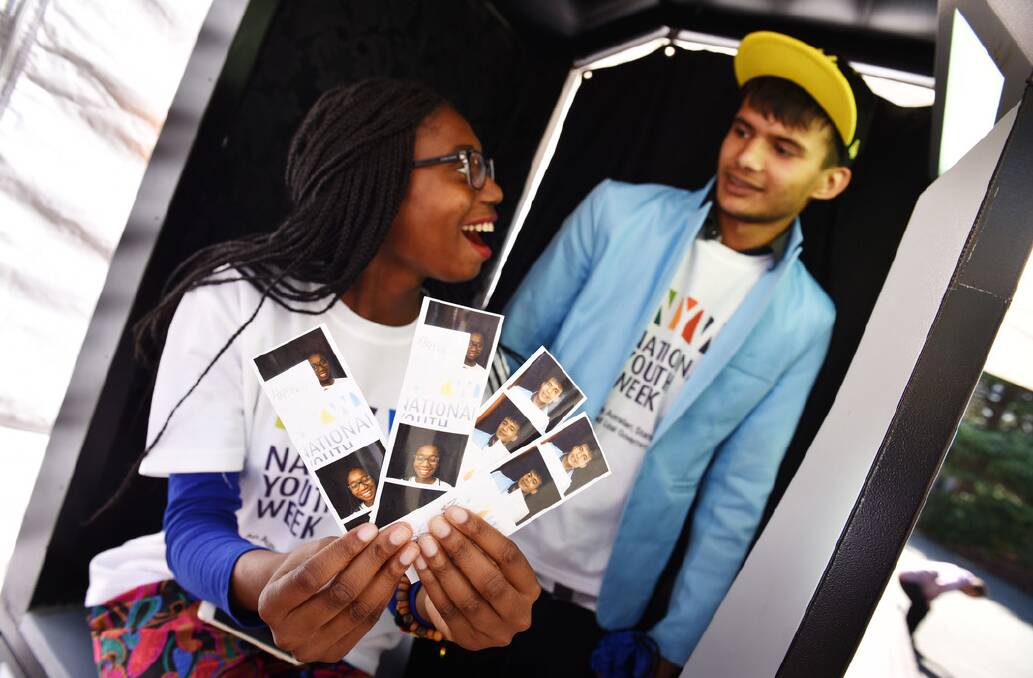 The Migrant Resource Centre's Grace Williams, 17, and Beda Dhakal, 20 of Launceston at the Photo Booth in Civic Square for National Youth Week. Picture: Scott Gelston
