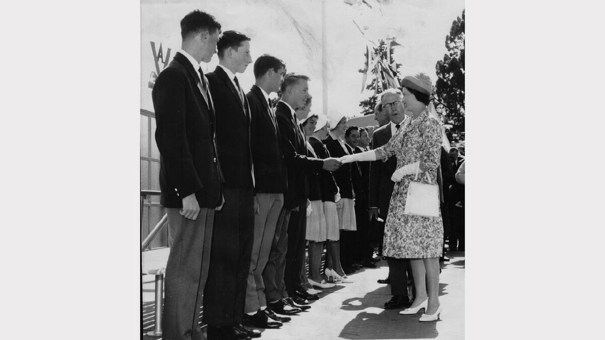 Queen Elizabeth and Prince Philip's 1963 royal visit | The Queen greets breastroke champion Henry Meskaukas.