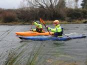 Constable Dan Smith and Senior Constable Ross McIvor in a previous search of the South Esk River for Ben Plowright, 20.