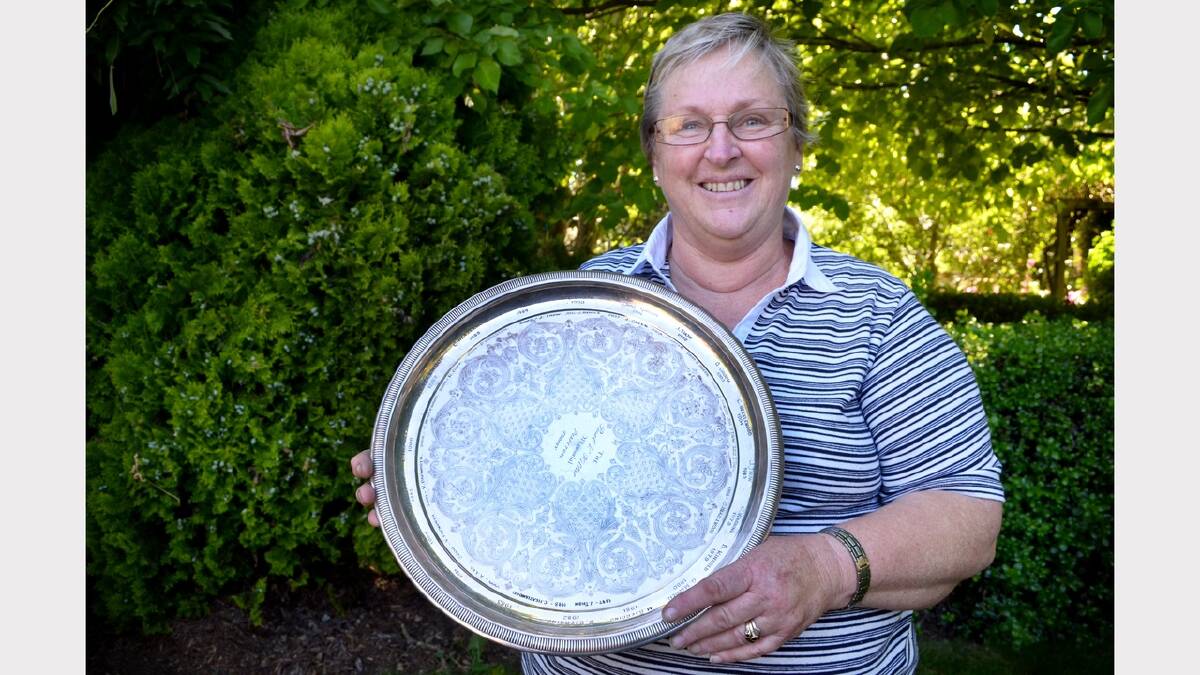 Westbury Garden Club's Heather Clarke with one of the show's perpetual trophies.