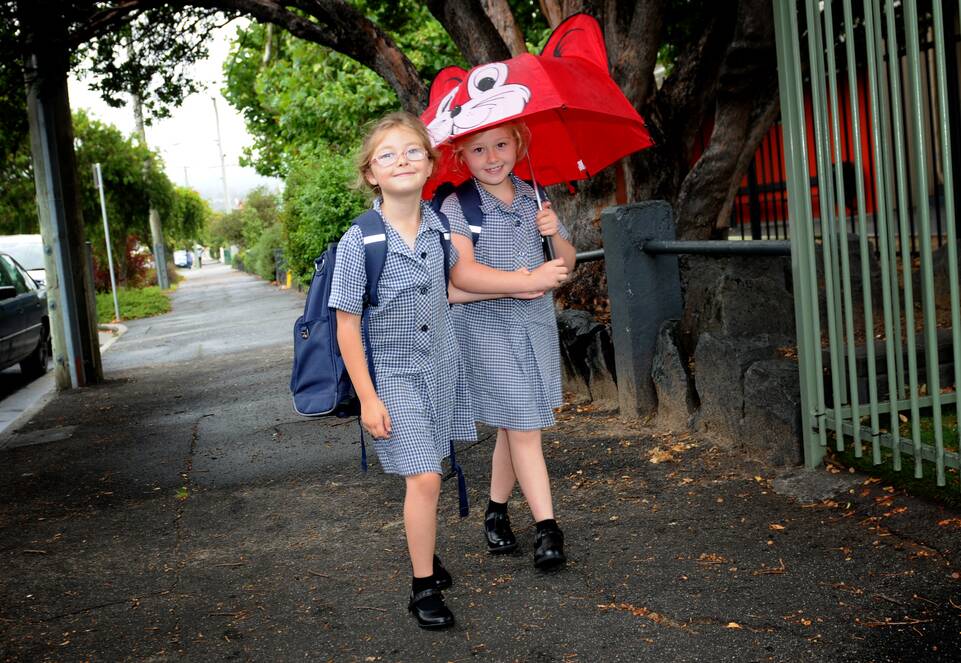 Invermay Primary School pupils Isabella Death-Morcom, 6, and Carenza-Jane Death-Morcom, 8, of St Leonards head off on their first school day for 2016. Picture: GEOFF ROBSON
