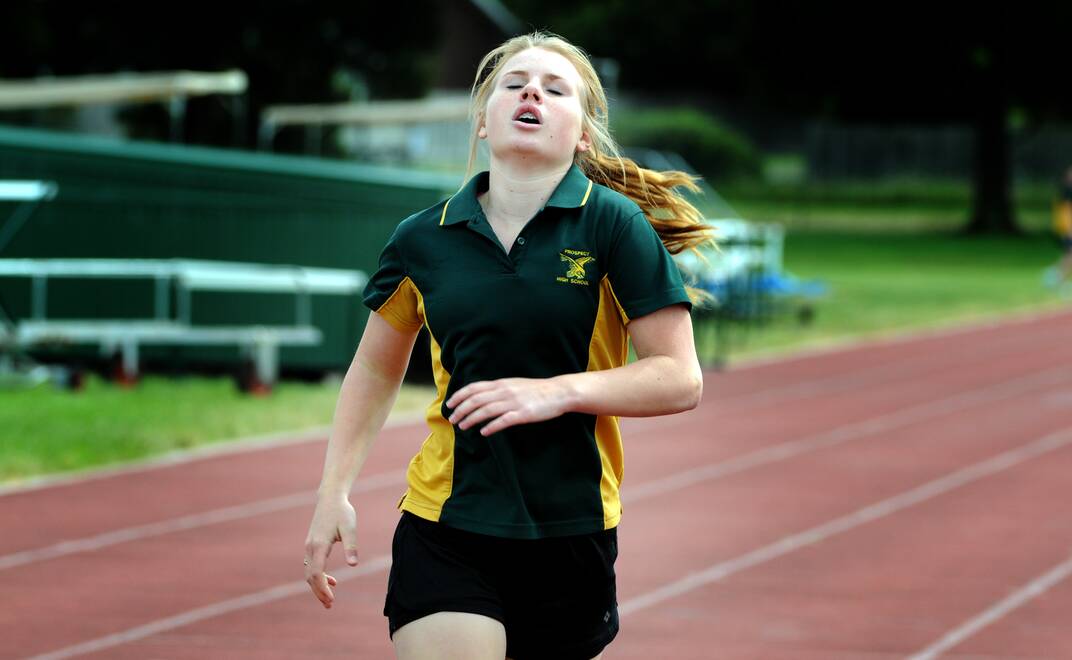 Portia Hamilton, 14, from Prospect High School competes in the Junior  Girls 200 metres. Picture: Geoff Robson