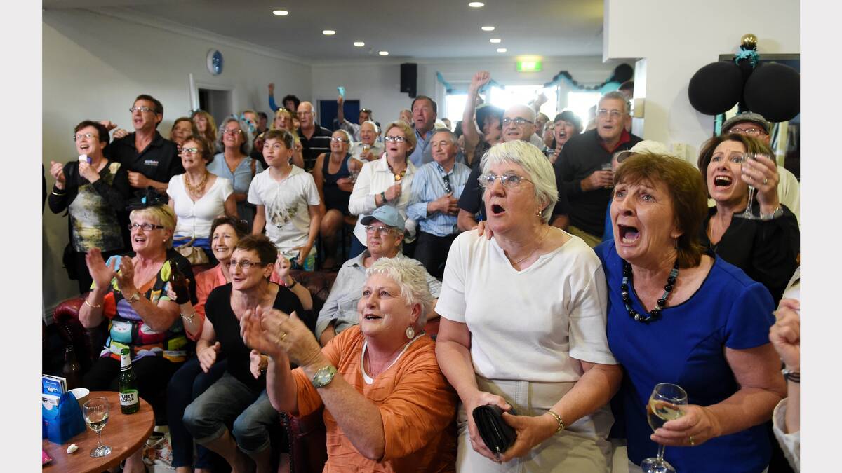 Beryl Perry and Maree Chugg (far right) cheer on The Cleaner at Longford's Queen Arms Hotel. Picture: Mark Jesser
