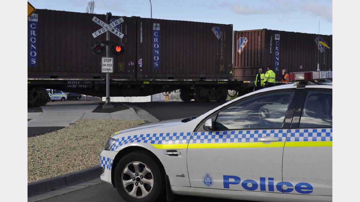 Crash investigators and forensics are on the scene at a Claremont level crossing where a woman was hit by a train earlier today. Picture: Georgie Burgess