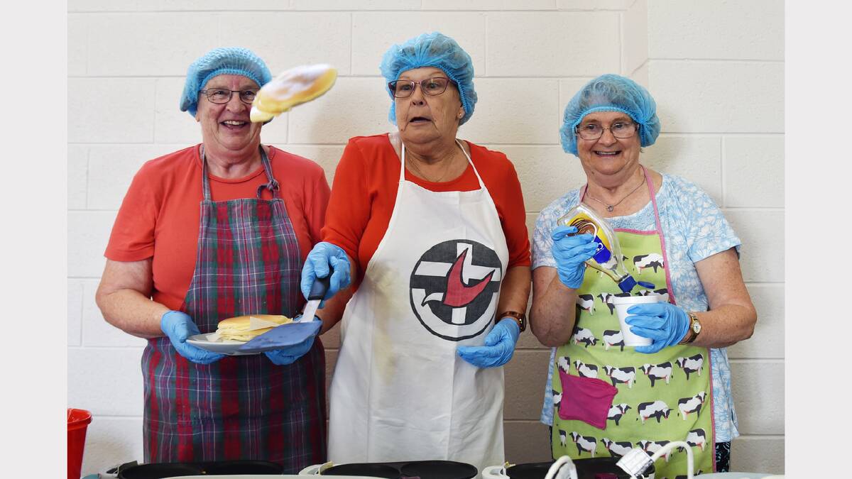 Longford Uniting Church members Martha Tymms, Margaret Watson and Rosemary Walkden finish off some of the 400-plus pancakes ordered during their Pancake Day event. Picture: SCOTT GELSTON