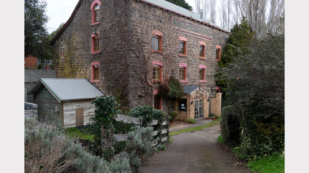 The convict-built Carrick Mill will be auctioned on July 5. The four-storey bluestone building sits on the banks of the Liffey River. Picture: MARK JESSER