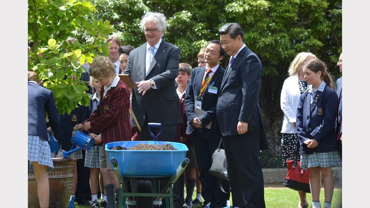 President Xi Jinping plants a Yulan Magnolia with Lieutenant Governor Alan Blow and Scotch Oakburn College pupils. Picture: Georgie Burgess