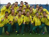 HOCKEY, DAY 11: The Australia team celebrate with their Gold Medals after winning the Men's Gold Medal Match. Photo: GETTY IMAGES