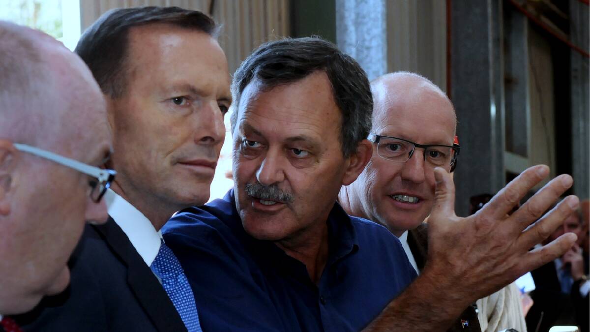 Charlton Farm Produce managing director David Addison has the ear of PM Tony Abbott at the announcement of the freight subsidy yesterday. Picture: NEIL RICHARDSON