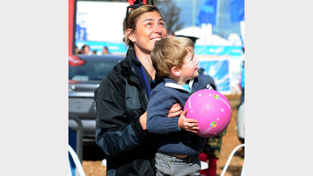 Former Australian netballer Eloise Southby with Toby Taylor, 3, of Hillwood at Agfest on Saturday. Picture: Neil Richardson.
