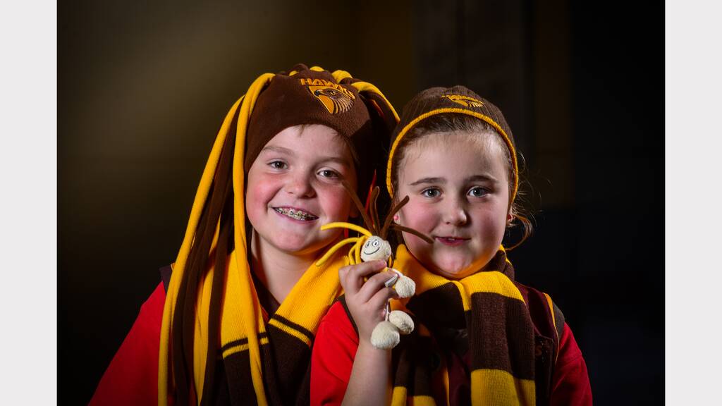 Jett, 8, and Amber Hill, 6, of Perth, are excited about going to Melbourne to watch Hawthorn take on Collingwood at the MCG. Picture: PHILLIP BIGGS