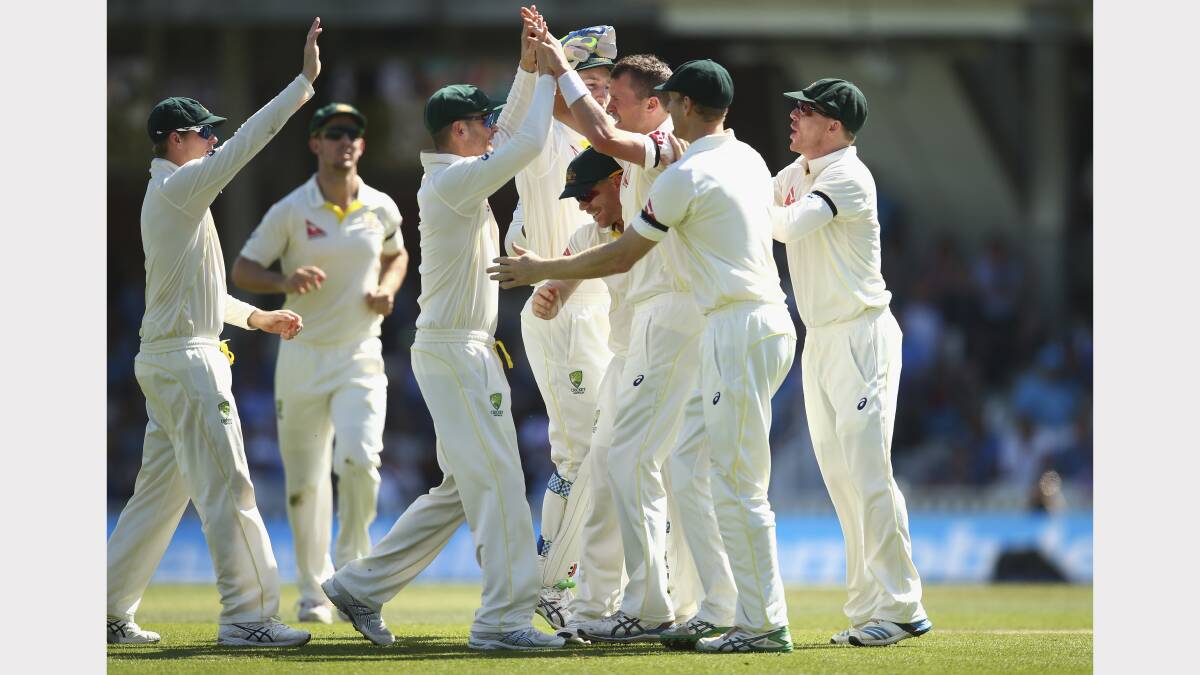 The Australians celebrate another English wicket. Picture: Getty Images. 