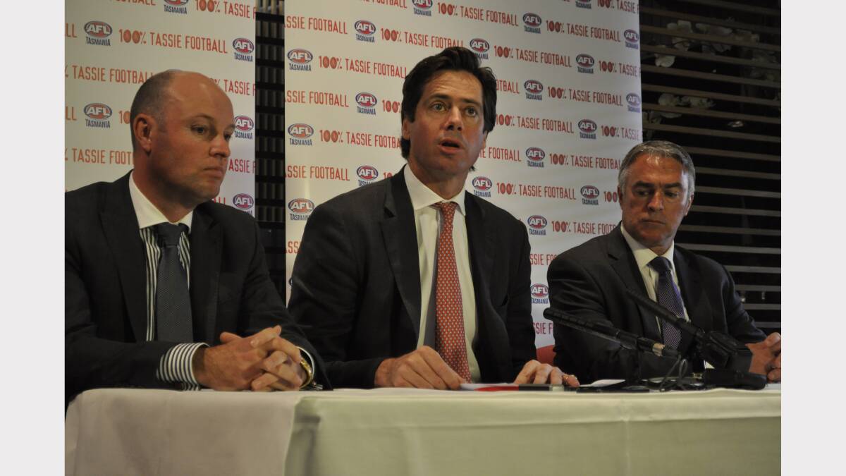 AFL deputy chief executive Gillon McLachlan (centre) fronts the media in Hobart flanked by AFL Tasmania chief executive Scott Wade (right) and outgoing chairman Dominic Baker (left). Picture: Rosemary Bolger.