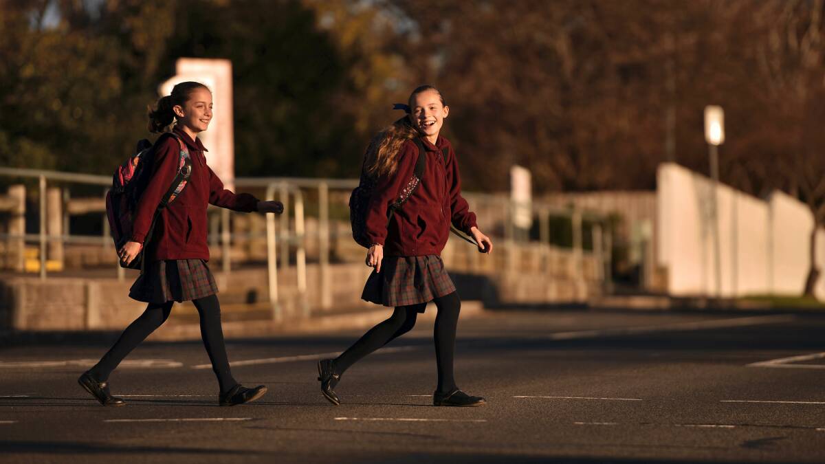 Launceston twins Miette and Amelie Richardson, 10, are excited to be returning to Punchbowl Primary this week. Picture: SCOTT GELSTON