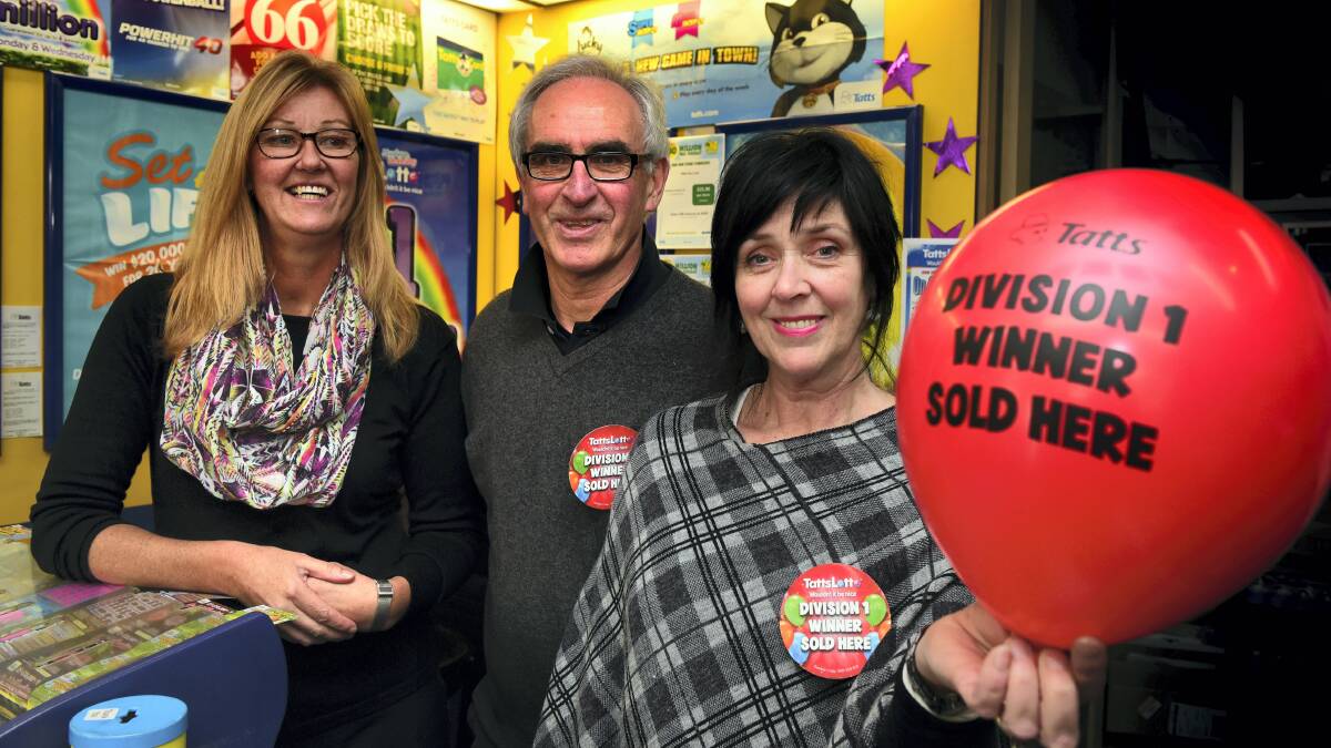 Employee Julie Leaman, with owners Garry and Donna Matthews of the Brisbane Street Newsagency, Launceston, celebrate selling a division 1 Tattslotto ticket. Picture: PAUL SCAMBLER
