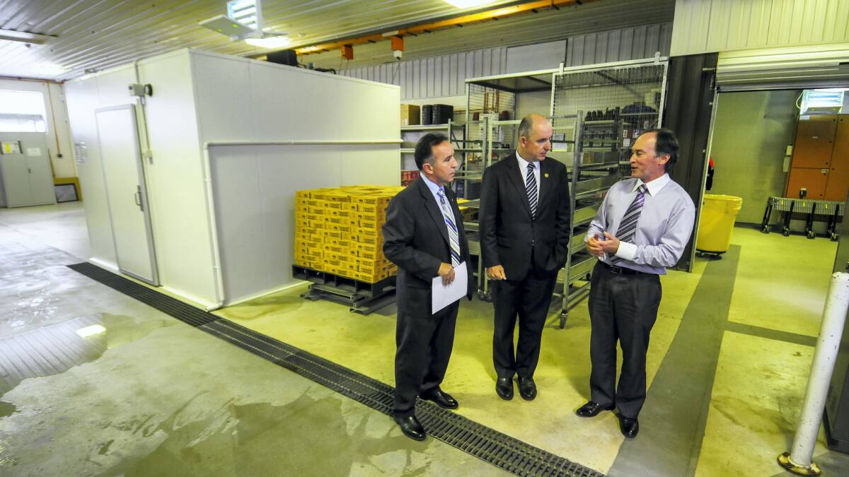Defence Science and Technology Organisation Scottsdale defence foods manager Ross Coad shows Bass Liberal MHR Andrew Nikolic and Assistant Defence Minister Stuart Robert around the facility. Picture: PHILLIP BIGGS