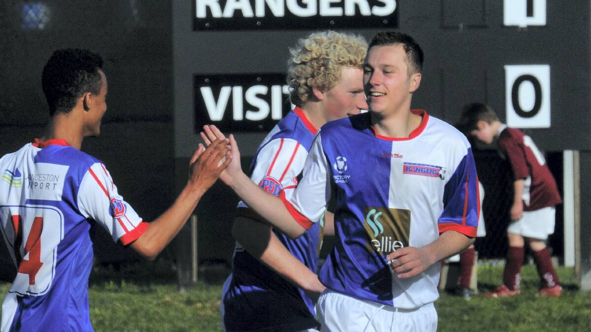 Northern Rangers’ Aidan Rigby congratulates teammate Ryan McCarragher for scoring a goal. Rigby is getting better by the week, his coach says.