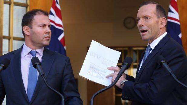 Josh Frydenberg with then prime minister Tony Abbott in 2015.  Photo: Andrew Meares
