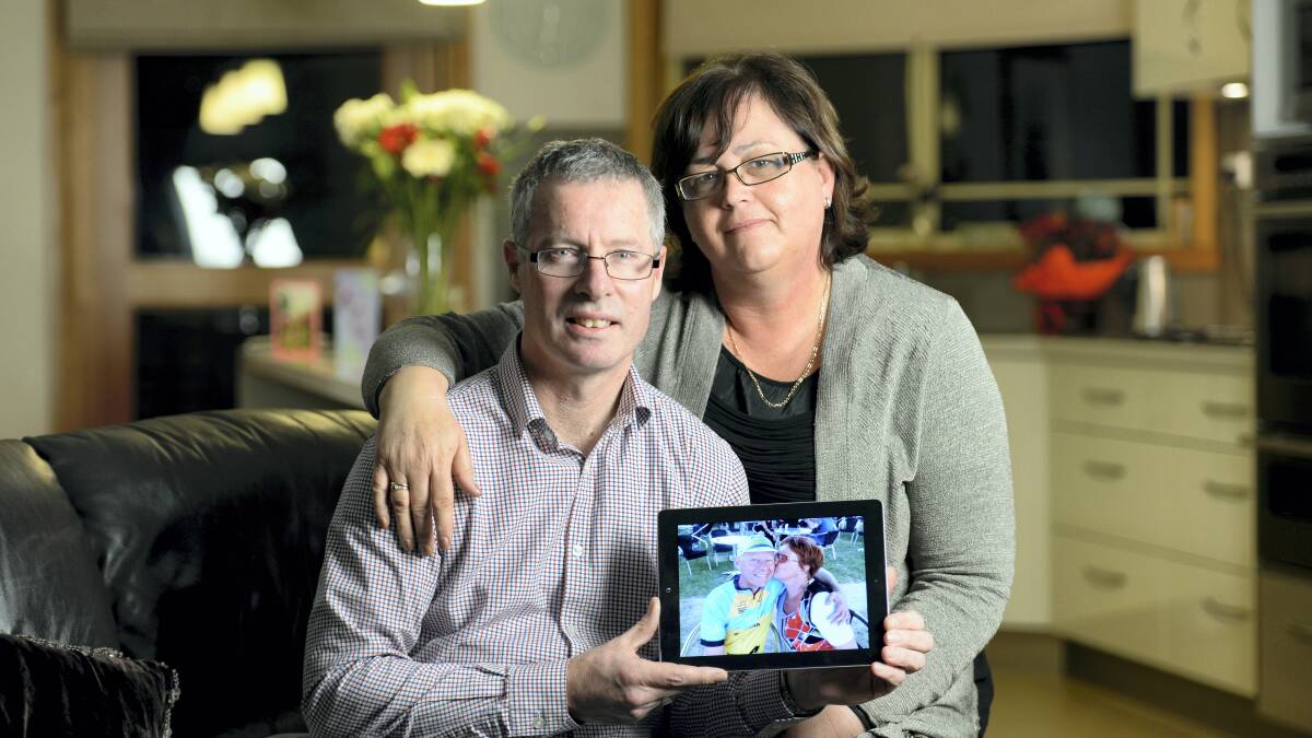 Philip and Therese de Ruiter with a picture of Philip’s brother Arjen Ryder and wife Yvonne, who were killed on flight MH17.Picture: PHILLIP BIGGS