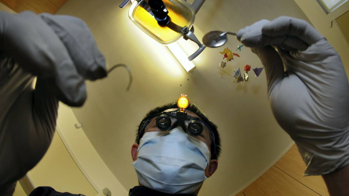 The Dental Surgery general dentist Theodore Pang is a strong proponent of school dental programs and education to raise dental health in Tasmania.  Picture: PAUL SCAMBLER
