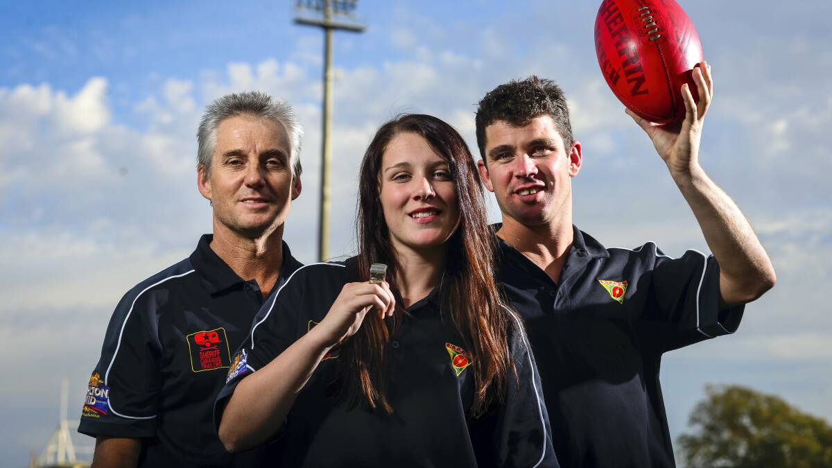 Montana Stubbings, 15, is continuing the family tradition of football umpiring with  her grandfather Chris Robson and  father Damon Robson. Picture: PHILLIP BIGGS.