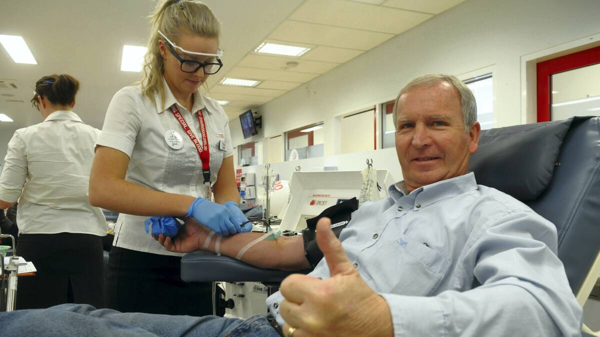 Graham Goddard, of St Helens, in for his 500th donation to the Red Cross Blood Service, with nurse Kristy Pel.  Picture: PAUL SCAMBLER 
